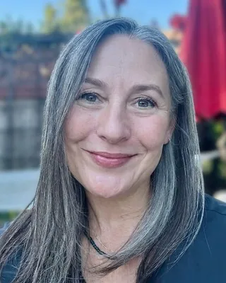Elizabeth Smith, LMFT, smiling outdoors